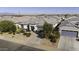 Single-story home featuring desert landscaping and a gray two-car garage at 38162 W Santa Monica Ave, Maricopa, AZ 85138