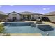 Stunning backyard pool and patio area creating a luxurious outdoor space at 38162 W Santa Monica Ave, Maricopa, AZ 85138