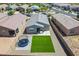 An aerial view of a backyard complete with artificial turf and a trampoline at 40176 W Williams Way, Maricopa, AZ 85138