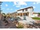 Backyard with large pool, multiple seating options, privacy landscaping and clear blue skies at 4043 W Aire Libre Ave, Phoenix, AZ 85053