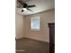 Cozy bedroom with a window, ceiling fan, and neutral carpet at 416 W Mission Ln, Phoenix, AZ 85021