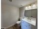 This powder bath features tile floor, decorative vanity and modern mirror at 4216 E Tether Trl, Phoenix, AZ 85050