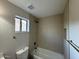 Bathroom featuring modern tilework, dark fixtures, and a shower/tub combo at 4216 E Tether Trl, Phoenix, AZ 85050