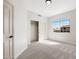 Bedroom with neutral carpet and paint, closet, and a window with a grid design at 4216 E Tether Trl, Phoenix, AZ 85050