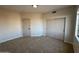 Bedroom featuring neutral walls and carpet, along with closet at 4216 E Tether Trl, Phoenix, AZ 85050