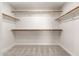 The spacious walk-in closet offers ample shelving and wood closet rods for maximum storage at 4216 E Tether Trl, Phoenix, AZ 85050