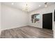 Elegant dining room with modern chandelier, wood-style floors and large window perfect for entertaining guests at 4216 E Tether Trl, Phoenix, AZ 85050