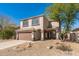 Charming two-story home featuring a spacious two-car garage and desert landscaping at 4216 E Tether Trl, Phoenix, AZ 85050