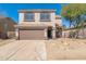 Charming two-story home featuring a spacious two-car garage and desert landscaping at 4216 E Tether Trl, Phoenix, AZ 85050