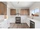 Modern kitchen featuring stainless steel appliances, white cabinets, and ample countertop space for cooking and entertaining at 4216 E Tether Trl, Phoenix, AZ 85050