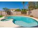 Inviting backyard oasis featuring a sparkling pool, spa, and lush landscaping at 4216 E Tether Trl, Phoenix, AZ 85050