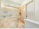 Bathroom featuring a spacious shower with marbled tile and glass enclosure at 4409 E Gelding Dr, Phoenix, AZ 85032