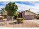 Charming single-story home featuring desert landscaping and a brick exterior at 4409 E Gelding Dr, Phoenix, AZ 85032