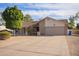 Inviting single-story home showcasing a well-maintained front yard and attached garage at 4409 E Gelding Dr, Phoenix, AZ 85032