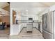 Beautiful kitchen with white cabinets, granite countertops, stainless steel appliances, and a functional center island at 4409 E Gelding Dr, Phoenix, AZ 85032