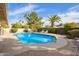 Sparkling pool with landscaped backyard and patio, offering a serene outdoor living space perfect for relaxing and entertaining at 4409 E Gelding Dr, Phoenix, AZ 85032