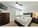 This bedroom features a ceiling fan, a flatscreen tv, and bedside dressers at 4620 N 68Th St # 111, Scottsdale, AZ 85251