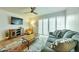 Cozy living room with a plush gray sofa, colorful rug, and bright natural light at 4620 N 68Th St # 111, Scottsdale, AZ 85251