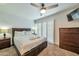 Main bedroom with a comfortable bed, side tables, and a ceiling fan at 4620 N 68Th St # 111, Scottsdale, AZ 85251