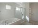 Bathroom featuring a luxurious tub and a separate glass-enclosed shower at 6451 N 17Th Pl, Phoenix, AZ 85016