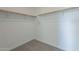 Walk-in closet with neutral carpet and wooden rods for clothes hanging at 6451 N 17Th Pl, Phoenix, AZ 85016