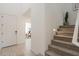 Inviting home entryway featuring light wood floors, a staircase, and a glimpse into a study at 6451 N 17Th Pl, Phoenix, AZ 85016