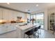 Modern kitchen featuring white cabinetry, stainless steel appliances, and a spacious island at 6451 N 17Th Pl, Phoenix, AZ 85016