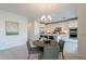 Kitchen adjacent to a dining area featuring an island with bar stool seating at 6451 N 17Th Pl, Phoenix, AZ 85016