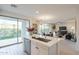 Open concept kitchen with island, modern appliances, and sliding doors to the patio at 6451 N 17Th Pl, Phoenix, AZ 85016