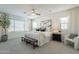 Bright primary bedroom featuring large windows, ceiling fan, and a king bed at 6451 N 17Th Pl, Phoenix, AZ 85016