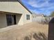 Expansive backyard featuring a block wall, a large sliding door, and a blank canvas for customization at 7321 N 123Rd Dr, Glendale, AZ 85307