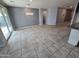 A cozy dining space featuring neutral walls, tile flooring, and sliding glass doors to the backyard at 7321 N 123Rd Dr, Glendale, AZ 85307