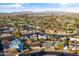 Picturesque aerial view of a suburban neighborhood with a nearby golf course and mountain range at 734 S Edgewater Dr, Mesa, AZ 85208