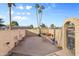 Fenced backyard with brick walls, patio, and minimal landscaping at 734 S Edgewater Dr, Mesa, AZ 85208