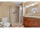 Bathroom featuring a framed shower, toilet, vanity with granite countertop, and a mirror at 734 S Edgewater Dr, Mesa, AZ 85208