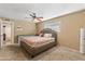 Bedroom with carpet, ceiling fan, neutral paint, queen bed, and window at 734 S Edgewater Dr, Mesa, AZ 85208