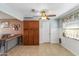 Bright dining area features a ceiling fan and built-in cabinets at 734 S Edgewater Dr, Mesa, AZ 85208