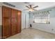 Bright dining area features a ceiling fan and built-in cabinets at 734 S Edgewater Dr, Mesa, AZ 85208