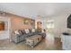 Comfortable living room featuring tile flooring and a sectional sofa at 734 S Edgewater Dr, Mesa, AZ 85208