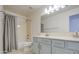 Bright bathroom with a double sink vanity, shower over tub, and neutral color scheme at 792 W Nolan Way, Chandler, AZ 85248