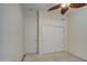 Bedroom with a ceiling fan and closet, offering a simple, comfortable living space at 792 W Nolan Way, Chandler, AZ 85248