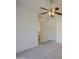 Bright bedroom featuring a ceiling fan and neutral carpeting, ready for personalization at 792 W Nolan Way, Chandler, AZ 85248