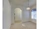 Bright dining area with archway to kitchen, decorative lighting, and a large window at 792 W Nolan Way, Chandler, AZ 85248