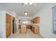 Spacious kitchen featuring an island, stainless steel refrigerator and tiled floor for easy clean-up at 792 W Nolan Way, Chandler, AZ 85248