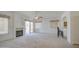 Spacious living room featuring a fireplace, ceiling fan, and plenty of natural light at 792 W Nolan Way, Chandler, AZ 85248