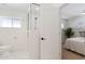 Bathroom featuring a glass shower with a rainfall shower head and white marble flooring at 800 W Erie St, Chandler, AZ 85225