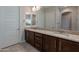 Bathroom featuring double vanity, granite countertop, and tile flooring at 8180 W Silver Spring Way, Florence, AZ 85132