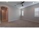 Spacious bedroom featuring plush carpet and an arched doorway at 8180 W Silver Spring Way, Florence, AZ 85132