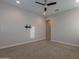 Inviting bedroom with ceiling fan, carpet, and TV mount is ready for you at 8180 W Silver Spring Way, Florence, AZ 85132