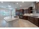 Spacious kitchen with a granite island, and rich cabinetry at 8180 W Silver Spring Way, Florence, AZ 85132